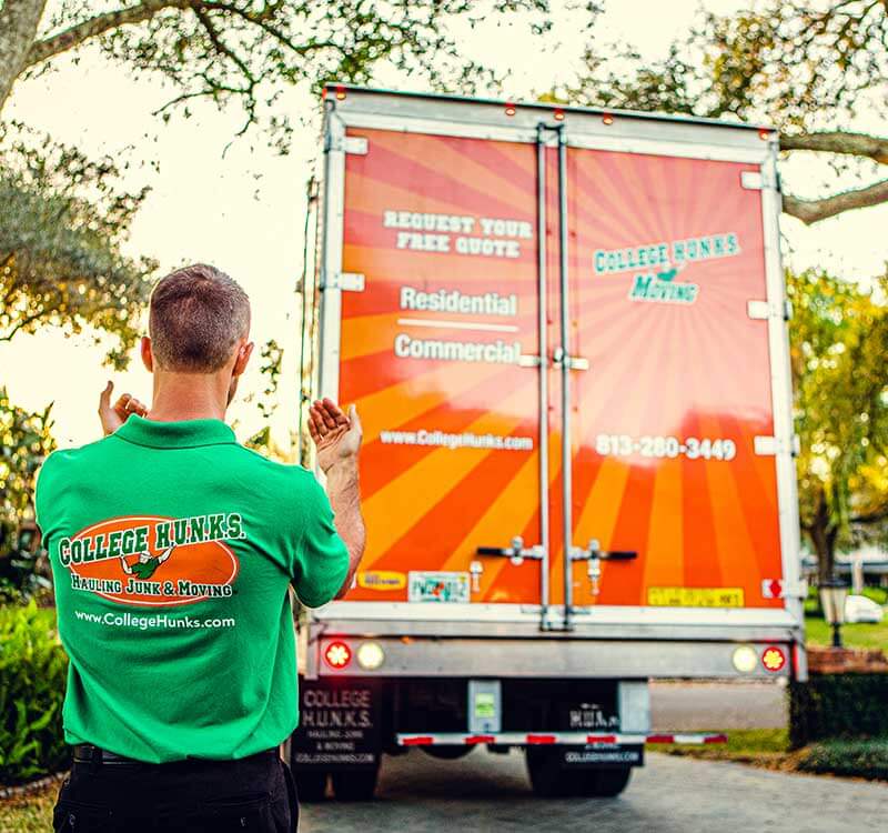 College Hunks Employee and Truck